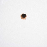 drilled hole in the wall